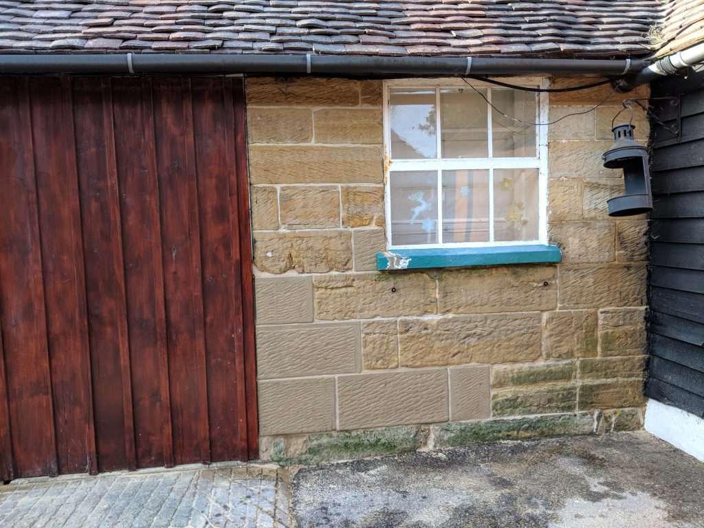 Stone repairs and replacement on sandstone building