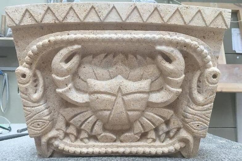 Romanesque arch stone depicting Cancer the Crab